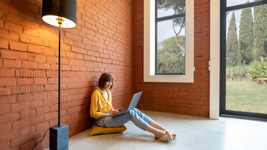 A person analyzing past booking trends on a laptop.