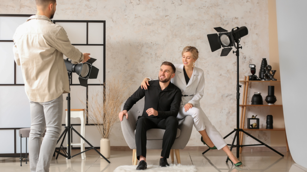 A professional photographer capturing high-quality images of a stylishly decorated shoot location.