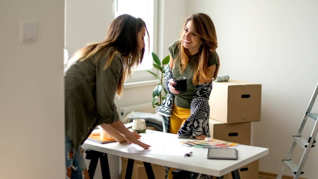 A host discussing feedback with a client after a successful shoot.