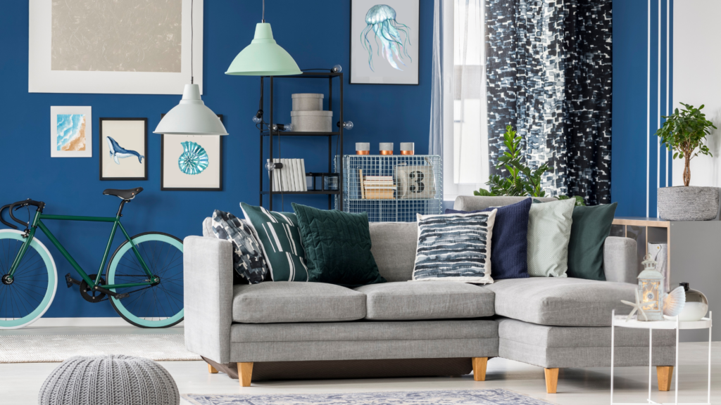 A coastal-themed living room with blue and white decor and nautical accents.