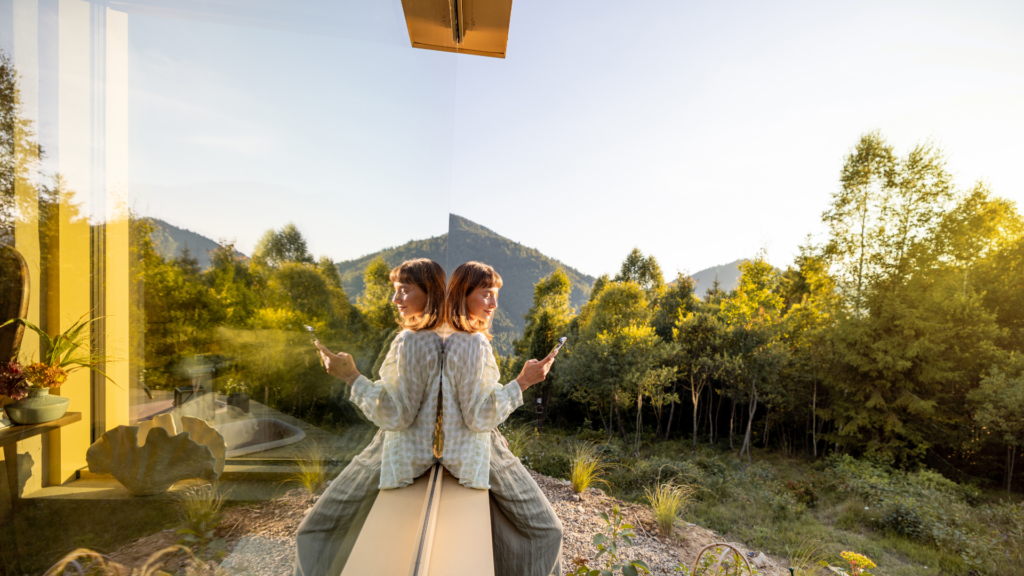  A woman on her phone posting a picture of a shoot location, generating high engagement and interest.